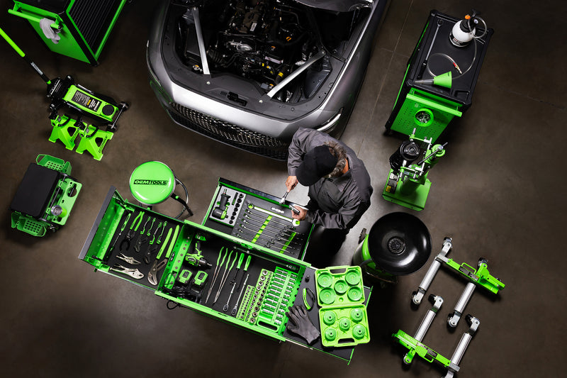 OEMTOOLS Technician working with a full set of hand tools and equipment in a workshop setting